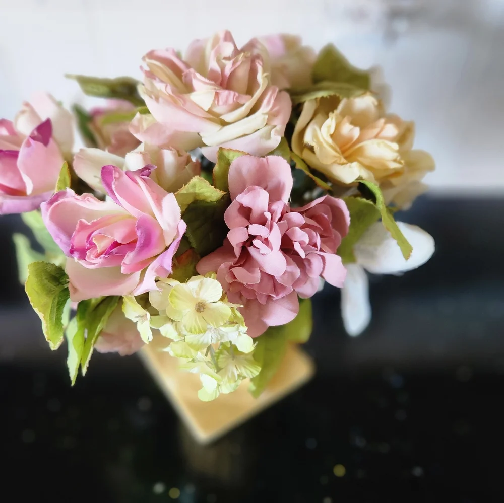 Beautiful faux flowers in vase